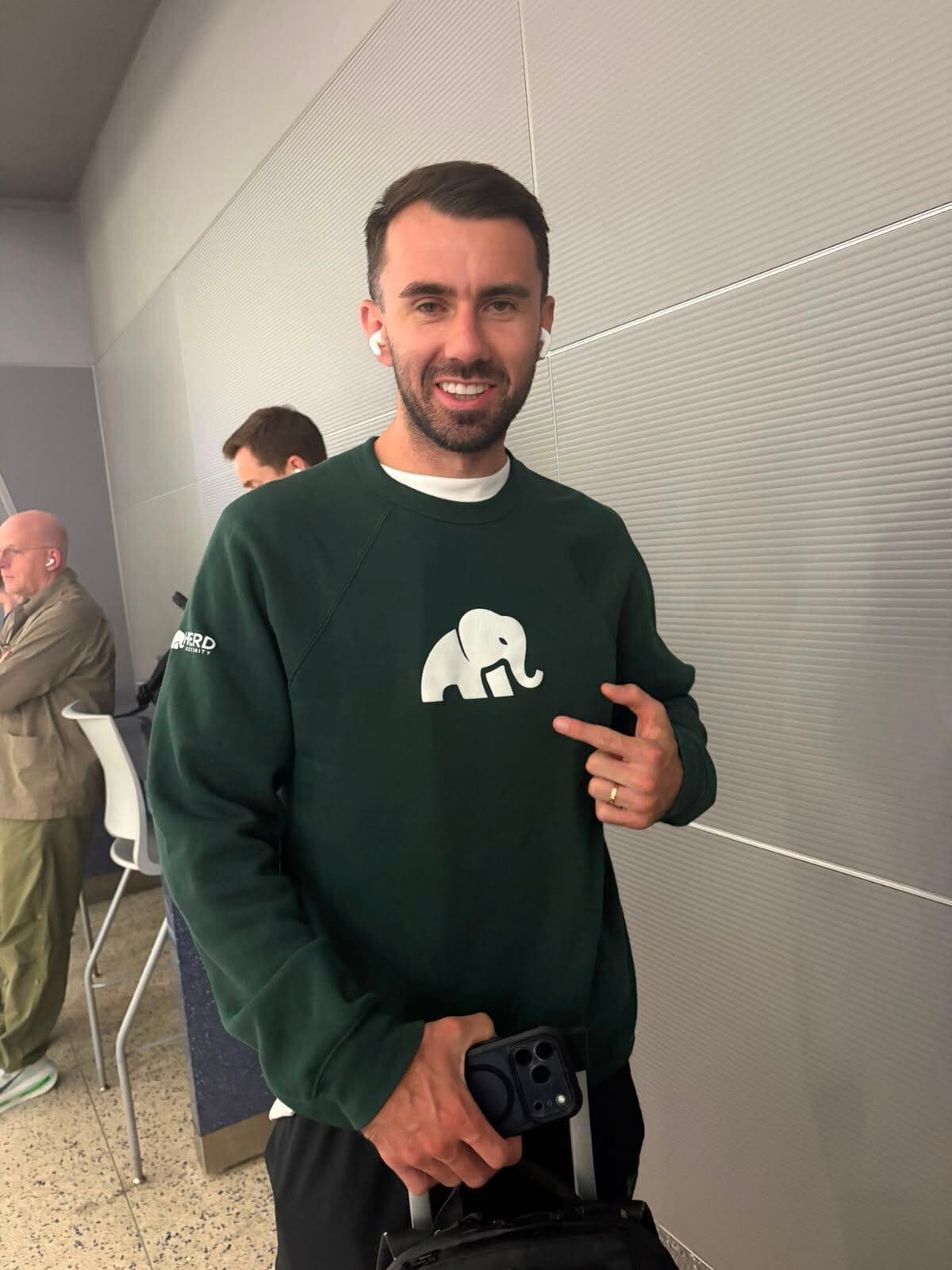 Team member wearing the Herd Security elephant sweatshirt
